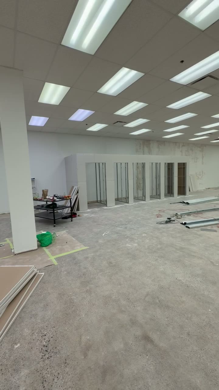 Finished lit T-bar ceiling grid in a retail store